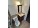 Cozy bathroom features tiled floors, toilet, and a vanity at 588 Empire St, Aurora, CO 80010