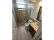 Cozy bathroom featuring tiled floors and glass enclosed shower at 588 Empire St, Aurora, CO 80010
