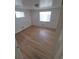 Large bedroom featuring multiple windows and hardwood floors at 588 Empire St, Aurora, CO 80010