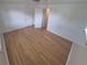 A spacious bedroom featuring hardwood floors, white walls, and two closets at 588 Empire St, Aurora, CO 80010