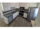 A kitchen with white cabinets, laminate countertops, and stainless steel appliances at 588 Empire St, Aurora, CO 80010