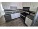 A kitchen with white cabinets, laminate countertops, and stainless steel appliances at 588 Empire St, Aurora, CO 80010