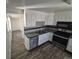 A kitchen with white cabinets, laminate countertops, and stainless steel appliances at 588 Empire St, Aurora, CO 80010