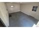 Sunroom with painted brick walls, concrete floor and access to the backyard at 588 Empire St, Aurora, CO 80010