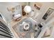 Aerial view of open living room with wood floors, rug, modern furnishings and skylights at 8783 S Ault Ln, Morrison, CO 80465