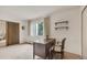 Bedroom area featuring a large window, wooden desk and room divider at 13800 E Marina Dr # 112, Aurora, CO 80014