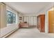 Bedroom with a large window, wooden desk, closets and natural light at 13800 E Marina Dr # 112, Aurora, CO 80014
