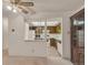 View into a kitchen with oak colored cabinets, appliances, and a skylight at 13800 E Marina Dr # 112, Aurora, CO 80014