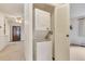Interior laundry closet with a stacked washer and dryer in a neutrally decorated home at 13800 E Marina Dr # 112, Aurora, CO 80014