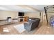 Finished basement features a fireplace, large TV, and tile flooring at 6856 S Broadway, Centennial, CO 80122