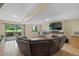 Finished basement features fireplace, large TV, sliding glass door, and tile flooring at 6856 S Broadway, Centennial, CO 80122