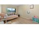bedroom features laminate wood flooring, a closet, and a large window at 6856 S Broadway, Centennial, CO 80122