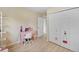 bedroom features a desk, closet, and laminate wood flooring at 6856 S Broadway, Centennial, CO 80122
