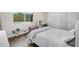 Bright bedroom features wood floors, large window, a desk and closet with mirrored doors at 6856 S Broadway, Centennial, CO 80122