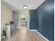 Dining area leading into kitchen with a sideboard and modern flooring at 6856 S Broadway, Centennial, CO 80122
