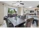 The dining room and kitchen are connected, creating an open and airy space with natural light at 6856 S Broadway, Centennial, CO 80122