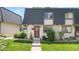 Charming townhouse with a well-manicured lawn and inviting entrance at 6856 S Broadway, Centennial, CO 80122