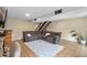 The cozy living room has a large sectional sofa, tile floors, and easy stair access at 6856 S Broadway, Centennial, CO 80122