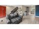 View of the living room with a staircase, hardwood floors, and elegant decor at 6856 S Broadway, Centennial, CO 80122
