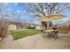 Large backyard with patio, mature tree, and a shed at 4940 Fenton St, Denver, CO 80212
