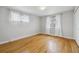 Bedroom with hardwood floors, closet and view to the outdoors at 4940 Fenton St, Denver, CO 80212