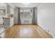Bright dining area with hardwood floors and a large window view to the outdoors at 4940 Fenton St, Denver, CO 80212