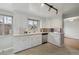 Spacious kitchen featuring stainless steel dishwasher, and views to the living area at 4940 Fenton St, Denver, CO 80212