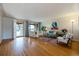 Inviting living room with hardwood floors, large windows, and a modern design at 4940 Fenton St, Denver, CO 80212