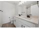 Clean bathroom with double sink vanity, white counters, and black fixtures at 1324 Sienna Peak Cir, Erie, CO 80516