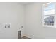 Bright laundry room features hookups and a window, making laundry a little less of a chore at 1324 Sienna Peak Cir, Erie, CO 80516