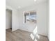 Room with hardwood floors, white walls, a large window and neutral decor, bright and airy at 1324 Sienna Peak Cir, Erie, CO 80516