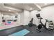 Spacious basement gym area with exercise equipment and a separate seating area for relaxation at 2679 Leafdale Cir, Castle Rock, CO 80109