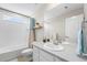 Bright bathroom offers a shower-tub combo, storage vanity, and ample lighting at 2679 Leafdale Cir, Castle Rock, CO 80109
