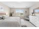 Cozy bedroom features ample natural light, carpet flooring, and neutral decor at 2679 Leafdale Cir, Castle Rock, CO 80109