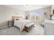 Bright bedroom boasts ample natural light, carpet flooring, and neutral decor at 2679 Leafdale Cir, Castle Rock, CO 80109