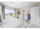 Bright bedroom with a white bed, large window, and decor adding a cozy and charming feel at 2679 Leafdale Cir, Castle Rock, CO 80109