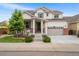 Charming two-story home with a well-maintained front yard, covered porch, and a two-car garage in a suburban neighborhood at 2679 Leafdale Cir, Castle Rock, CO 80109