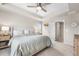 Spacious main bedroom features a tray ceiling with fan, neutral decor, and ensuite bathroom access at 2679 Leafdale Cir, Castle Rock, CO 80109