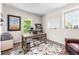 Bright home office with hardwood floors, large window, rustic desk, and a cozy leather armchair, perfect for remote work at 2679 Leafdale Cir, Castle Rock, CO 80109