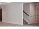 Unfinished basement with staircase and 2 doors to other rooms at 4741 Twelve Oaks Way, Castle Rock, CO 80104