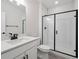 Modern bathroom featuring a glass-enclosed shower, white fixtures, and a sleek vanity for a clean, contemporary aesthetic at 4741 Twelve Oaks Way, Castle Rock, CO 80104