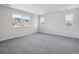 Spacious bedroom featuring plush carpeting and several bright windows at 4741 Twelve Oaks Way, Castle Rock, CO 80104