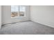 Bedroom with carpet flooring and two windows offering neighborhood views at 4741 Twelve Oaks Way, Castle Rock, CO 80104