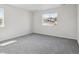 Bedroom with neutral carpet and a large window overlooking the neighborhood at 4741 Twelve Oaks Way, Castle Rock, CO 80104