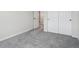 Bedroom with neutral carpet flooring, white baseboards and access to a closet at 4741 Twelve Oaks Way, Castle Rock, CO 80104