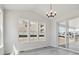 Dining room featuring large windows offering great natural light and sliding door to the outdoor patio at 4741 Twelve Oaks Way, Castle Rock, CO 80104