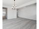 Elegant dining room featuring laminate flooring and a stylish chandelier, perfect for gatherings at 4741 Twelve Oaks Way, Castle Rock, CO 80104