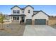 Charming two-story home with a three-car garage and covered porch at 4741 Twelve Oaks Way, Castle Rock, CO 80104