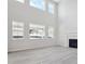 Bright, soaring living room with a fireplace and lots of natural light at 4741 Twelve Oaks Way, Castle Rock, CO 80104