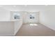 Bright loft area featuring neutral carpet, white walls, recessed lighting and natural light from multiple windows at 841 Alpine Ridge St, Erie, CO 80516